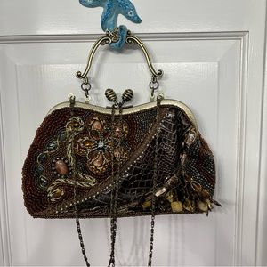 Chico’s beaded handbag.  Has both handle or chain.